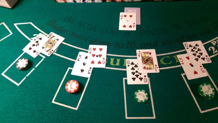 Dealer dealing cards to blackjack players